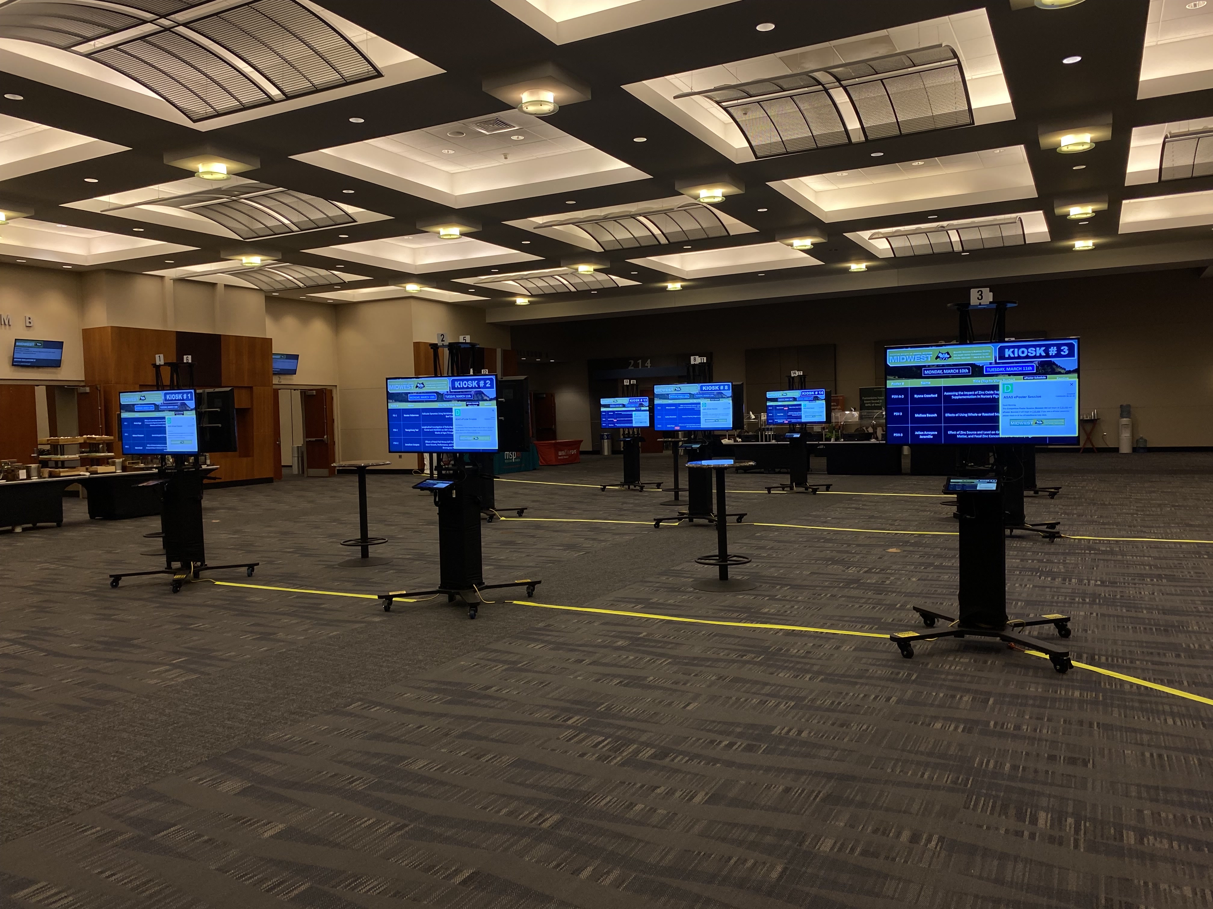 Digital poster boards arranged in an event space