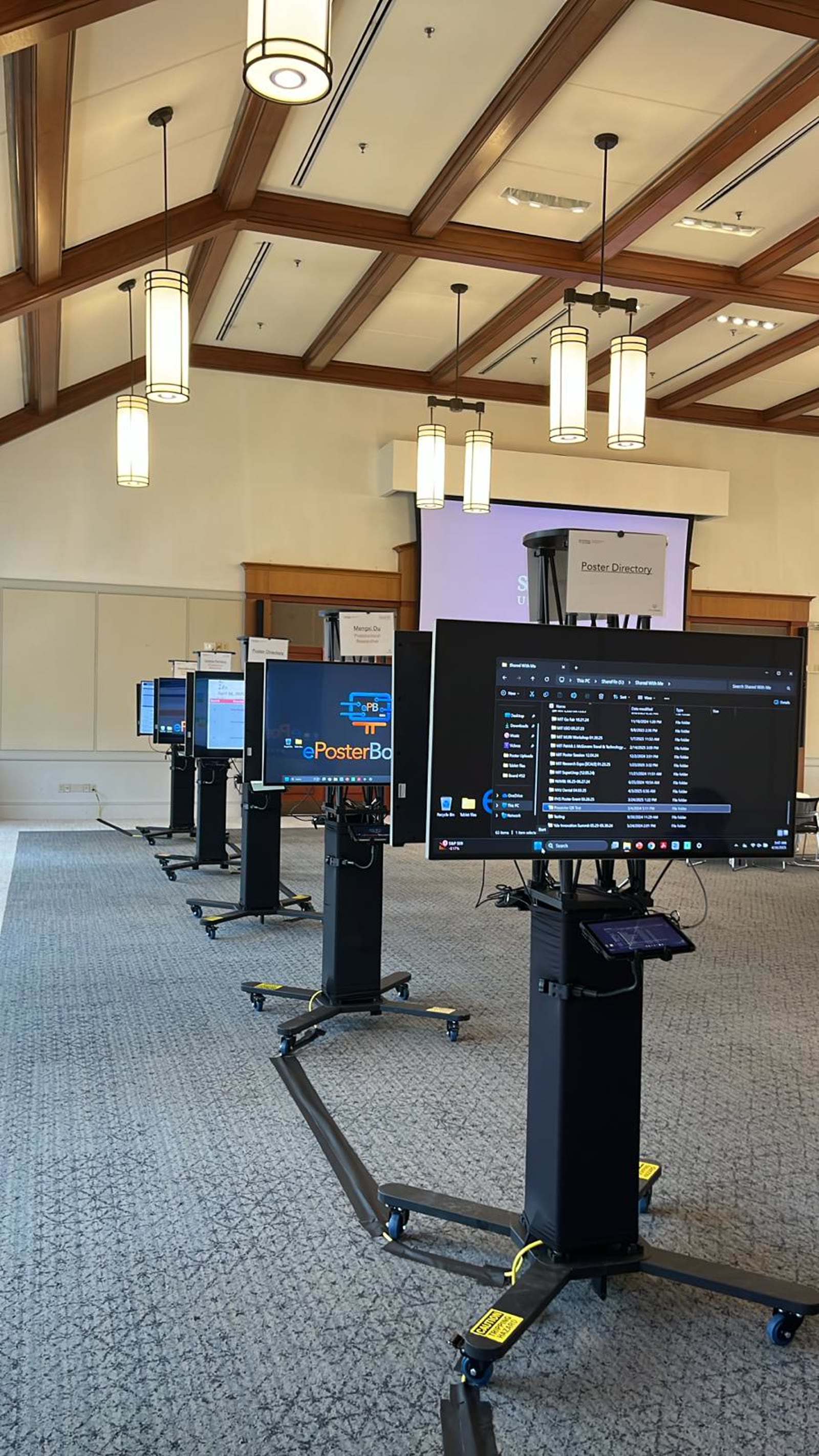 Digital display boards arranged through a conference venue